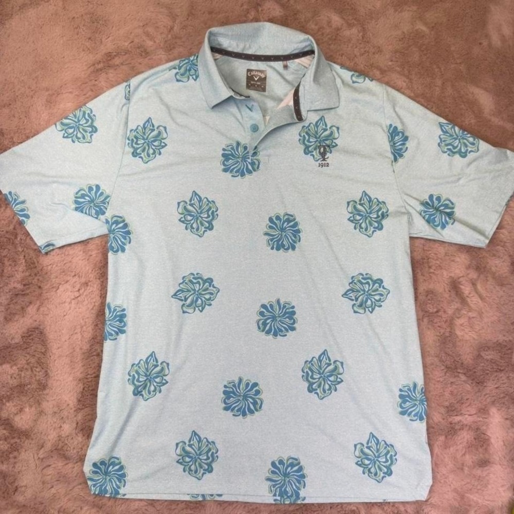 Performance golf polo by‎ Callaway featuring an all-over blue floral pattern